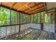 Rustic screened porch with wood flooring at 4090 Tara Dr, Forest Park, GA 30297