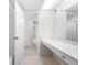 Simple bathroom with vanity, mirror, and access to other rooms at 6851 Roswell Rd # I29, Atlanta, GA 30328