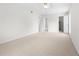 Bright bedroom with carpet, ceiling fan and access to bathroom and closet at 6851 Roswell Rd # I29, Atlanta, GA 30328
