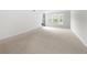 Bright bedroom with hardwood floors and sliding glass door to balcony at 6851 Roswell Rd # I29, Atlanta, GA 30328