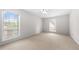 Well-lit bedroom featuring neutral walls and carpeted floors at 6851 Roswell Rd # I29, Atlanta, GA 30328