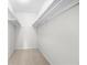 Large walk-in closet with double rods and neutral carpeting at 6851 Roswell Rd # I29, Atlanta, GA 30328