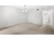 Spacious dining room with neutral walls and carpeting at 6851 Roswell Rd # I29, Atlanta, GA 30328