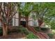 Building entrance with brick and landscaping at 6851 Roswell Rd # I29, Atlanta, GA 30328