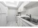 Clean kitchen with white cabinetry, stainless steel sink and appliances at 6851 Roswell Rd # I29, Atlanta, GA 30328