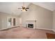 Living room with fireplace and access to back deck at 1834 River Rd, Mcdonough, GA 30252