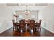 Elegant dining room featuring a large wood table and chandelier at 530 Besra Dr, Grayson, GA 30017