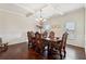 Bright dining area featuring a chandelier, hardwood floors and a decorative chair at 530 Besra Dr, Grayson, GA 30017