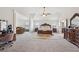 Spacious main bedroom with vaulted ceiling, fan, and natural light at 530 Besra Dr, Grayson, GA 30017