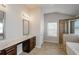 Elegant bathroom with double vanity, soaking tub, and separate shower at 5345 Bucknell Trce, Cumming, GA 30028