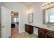 Bathroom with double vanity, and view of bedroom at 5345 Bucknell Trce, Cumming, GA 30028