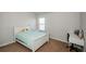 Bedroom with white bed and small workspace at 5345 Bucknell Trce, Cumming, GA 30028