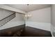 Formal dining room with hardwood floors, chandelier, and wainscoting at 5345 Bucknell Trce, Cumming, GA 30028
