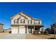 Brick two-story house with a two-car garage and landscaped yard at 5345 Bucknell Trce, Cumming, GA 30028