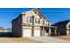 Two-story house with a two-car garage, and well-maintained landscaping at 5345 Bucknell Trce, Cumming, GA 30028