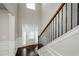 Bright foyer with hardwood floors, staircase, and double door at 5345 Bucknell Trce, Cumming, GA 30028