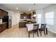 Kitchen with dark cabinets, granite counters, and breakfast nook at 5345 Bucknell Trce, Cumming, GA 30028