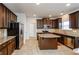 Modern kitchen with granite countertops and stainless steel appliances at 5345 Bucknell Trce, Cumming, GA 30028