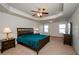 Main bedroom with carpeted floor and ceiling fan at 5345 Bucknell Trce, Cumming, GA 30028