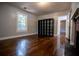 Bedroom with hardwood floors, bookcase and window at 99 Moreland Se Ave, Atlanta, GA 30316