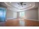 Large bedroom with hardwood floors and ceiling fan at 99 Moreland Se Ave, Atlanta, GA 30316