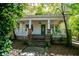 Charming white house with stone accents and a welcoming front porch at 99 Moreland Se Ave, Atlanta, GA 30316