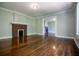 Hardwood floors, fireplace, and open concept to another living space at 99 Moreland Se Ave, Atlanta, GA 30316