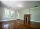 Living room with hardwood floors, fireplace, and view of another room at 99 Moreland Ave Se, Atlanta, GA 30316