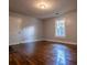 Bright living room with hardwood floors and neutral walls at 99 Moreland Se Ave, Atlanta, GA 30316
