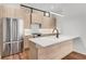 Modern kitchen with island, stainless steel appliances, and light wood cabinets at 105 Georgia Se Ave # 4, Atlanta, GA 30312