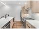 Modern kitchen with island, stainless steel appliances, and light wood cabinets at 105 Georgia Se Ave # 4, Atlanta, GA 30312