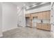 Open concept kitchenette with light wood cabinets and marble backsplash at 105 Georgia Se Ave # 4, Atlanta, GA 30312