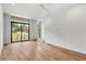 Bright living room with hardwood floors and sliding glass doors to balcony at 105 Georgia Se Ave # 4, Atlanta, GA 30312