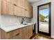 Wet bar with quartz countertop and access to outdoor patio at 105 Georgia Se Ave # 4, Atlanta, GA 30312