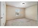 Simple bedroom with carpet, window, and doors at 2137 Chadwick Road, Atlanta, GA 30331