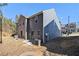 Gray townhome with small backyard, and bicycle storage at 2137 Chadwick Road, Atlanta, GA 30331