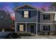 Attractive two-story townhome, gray siding, black shutters, inviting entryway at 2137 Chadwick Road, Atlanta, GA 30331