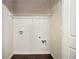 Small laundry area with wire shelving and hookups for washer/dryer at 2137 Chadwick Road, Atlanta, GA 30331