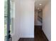 Bright hallway with dark hardwood floors and staircase at 712 Dodd Ln # 154, Buford, GA 30518
