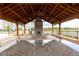 Community outdoor kitchen pavilion with stone fireplace at 712 Dodd Ln # 154, Buford, GA 30518