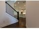 Modern staircase with dark wood railing and open concept at 712 Dodd Ln # 154, Buford, GA 30518