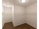 Spacious walk-in closet with ample shelving and hanging rods at 712 Dodd Ln # 154, Buford, GA 30518