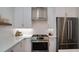 Modern kitchen features stainless steel appliances and white cabinets at 68 Peachtree Memorial - Dr # 68, Atlanta, GA 30309