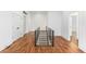 Modern hallway with hardwood floors and sleek metal railing at 1099 Hawthorne Ne St, Atlanta, GA 30307