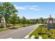 Landscaped entrance to the community with stone pillars at 1187 Rambler Cross, Atlanta, GA 30312