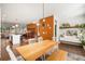 Open concept dining area features a large wooden table and connects to the kitchen at 1187 Rambler Cross, Atlanta, GA 30312