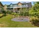 Stone fire pit nestled in a grassy area near townhomes at 1187 Rambler Cross, Atlanta, GA 30312