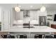 Modern white kitchen with stainless steel appliances and marble countertops at 1187 Rambler Cross, Atlanta, GA 30312