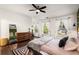 Bright main bedroom with a king bed, hardwood floors, and ample natural light at 1187 Rambler Cross, Atlanta, GA 30312