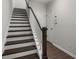 Modern staircase with dark wood steps and white risers at 1187 Rambler Cross, Atlanta, GA 30312